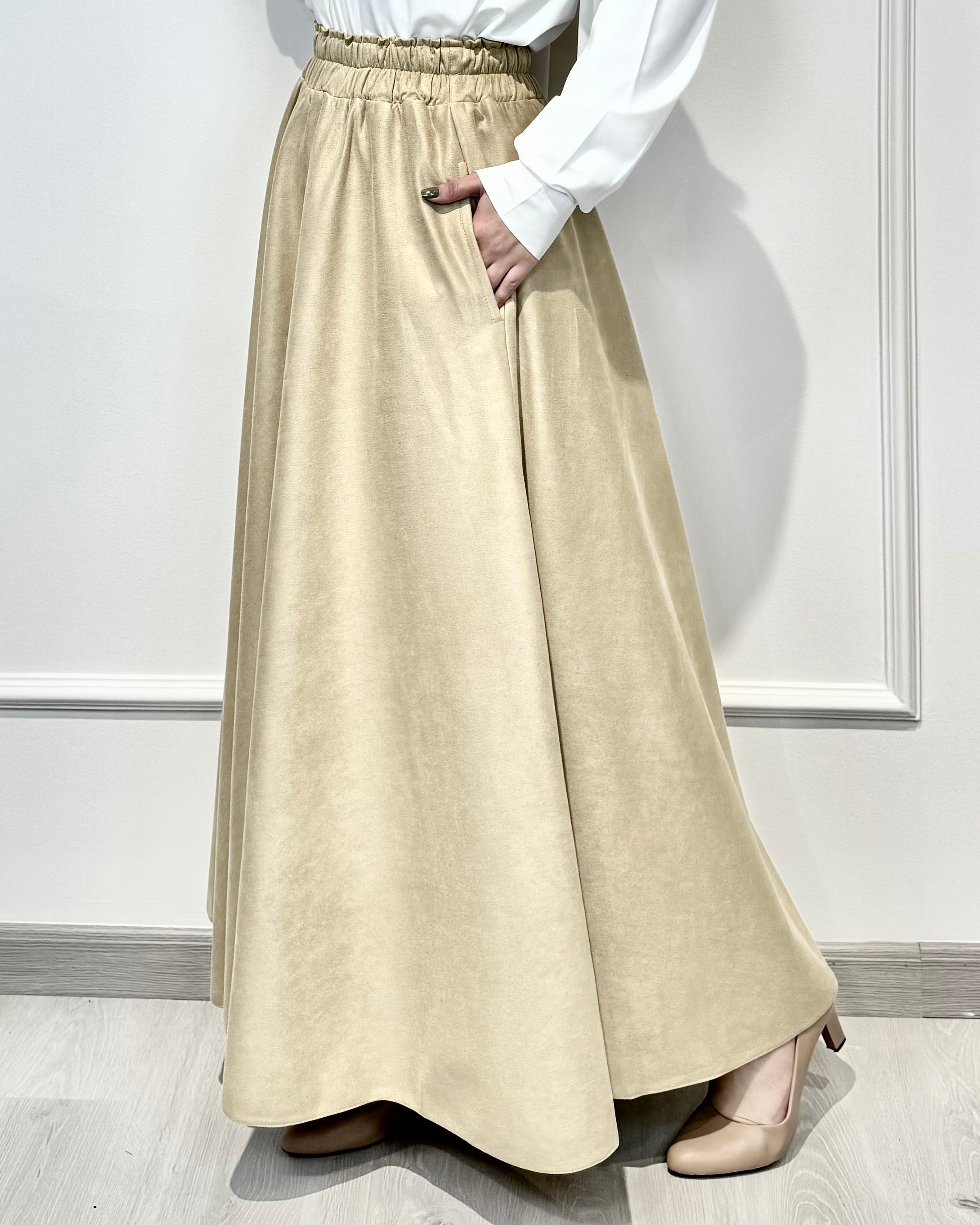 Beige full cloche suede skirt with soft texture and elegant modest style