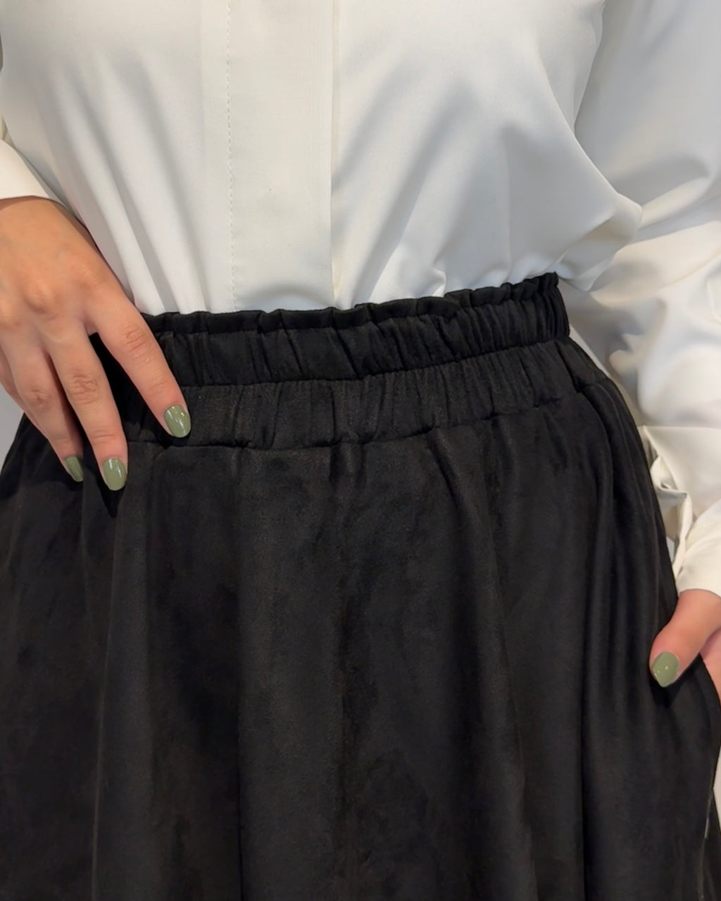 Black full cloche suede skirt with soft texture and elegant modest style