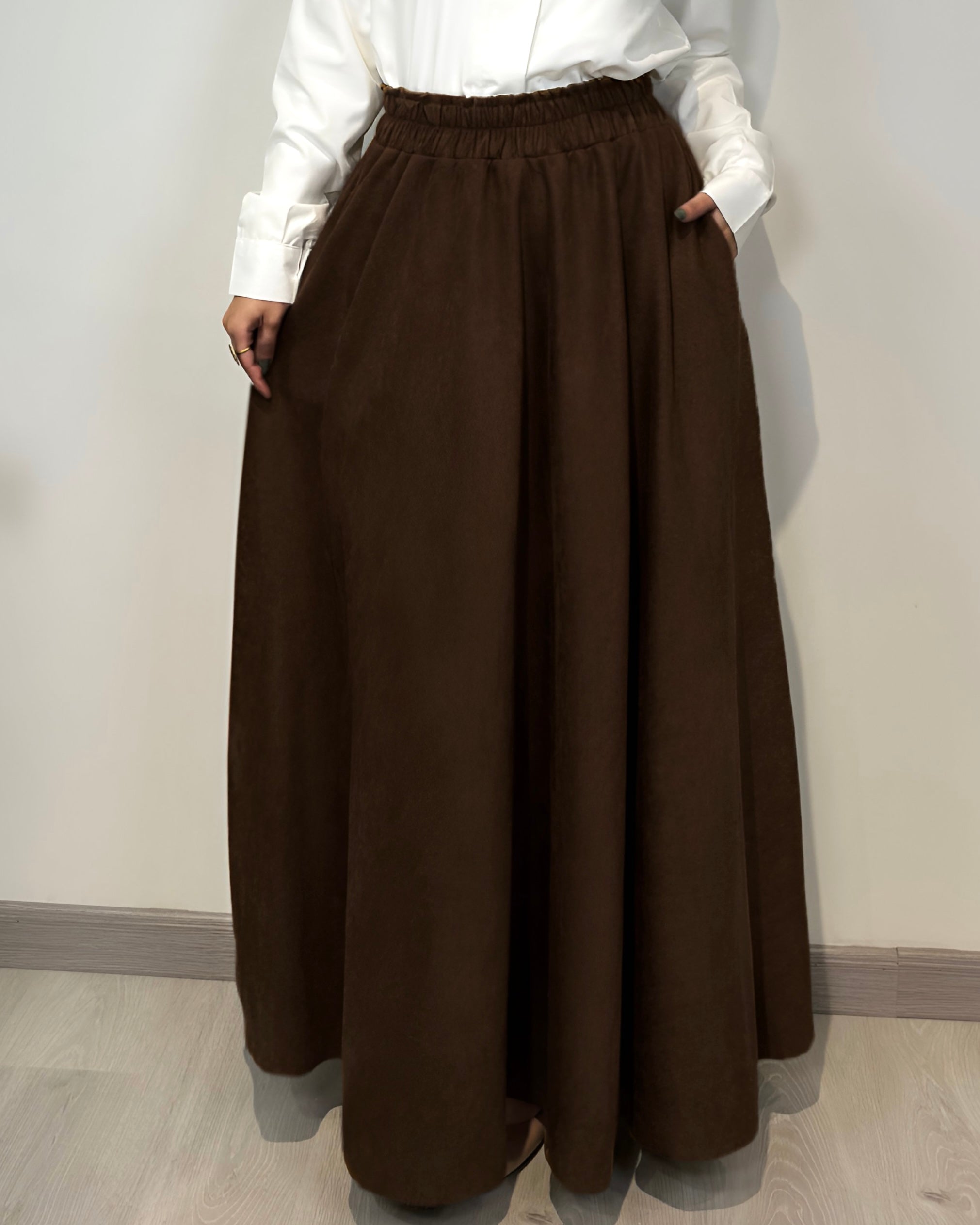 Brown full cloche suede skirt with soft texture and elegant modest style