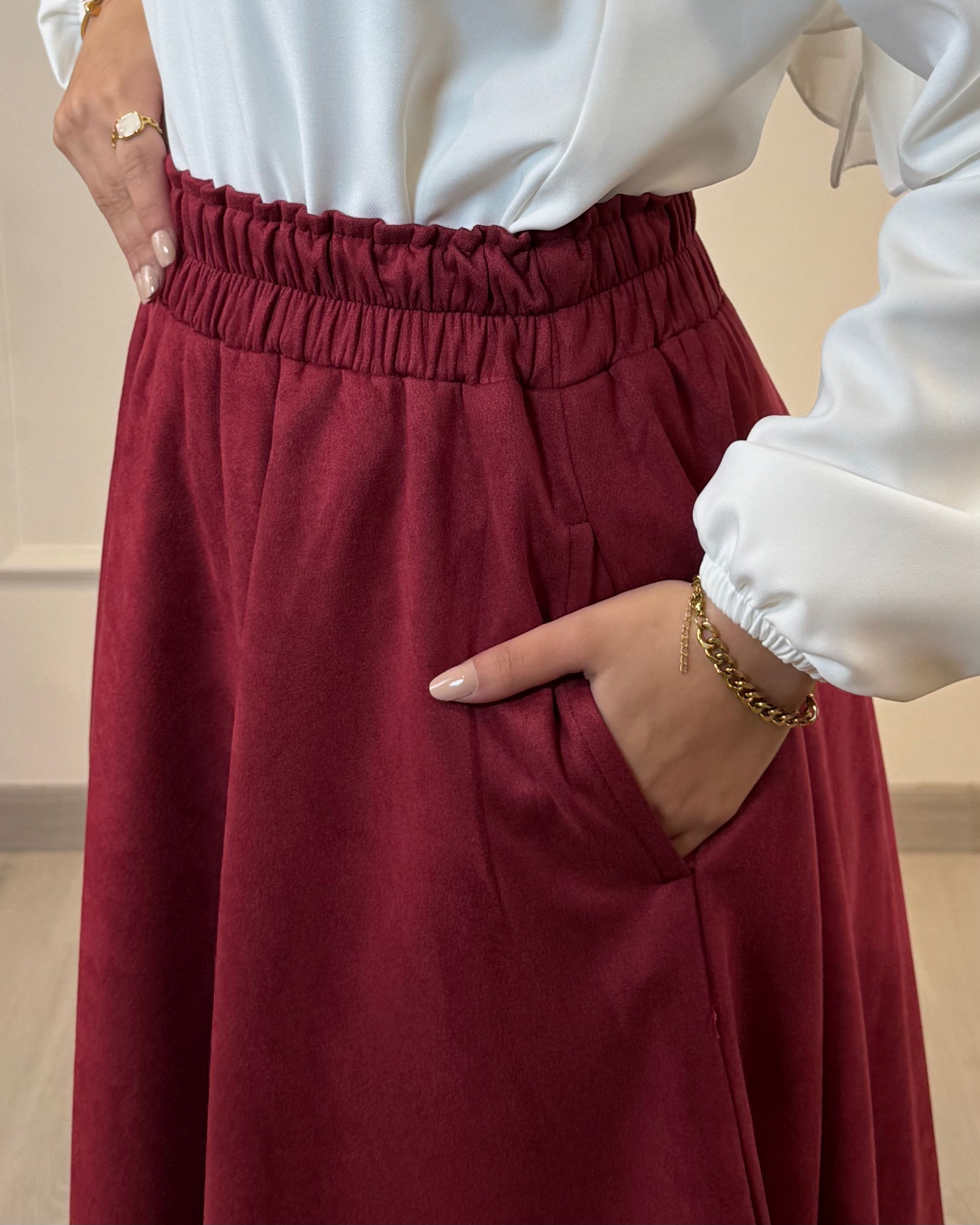 Burgundy full cloche suede skirt with soft texture and elegant modest style