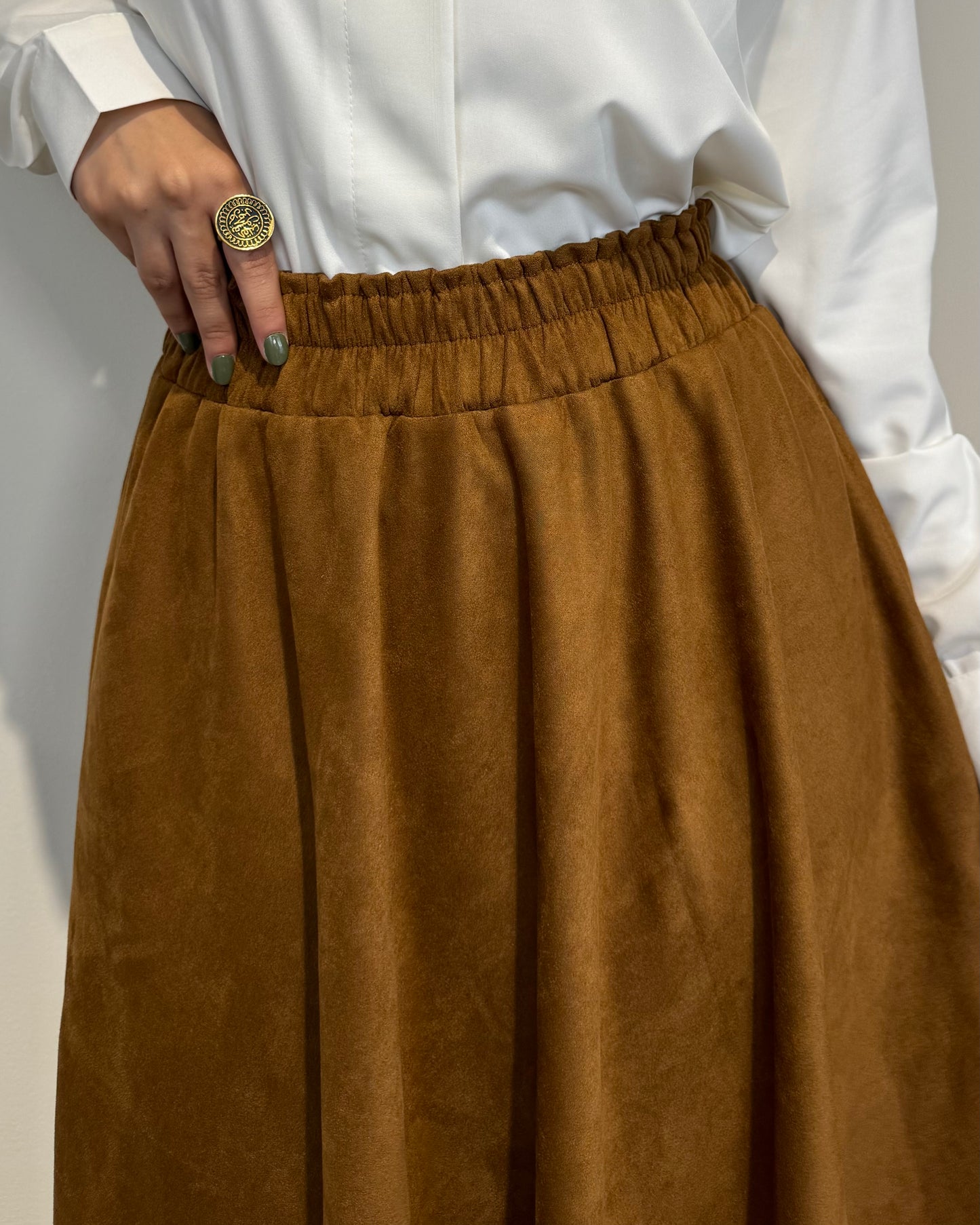 Camel full cloche suede skirt with soft texture and elegant modest style