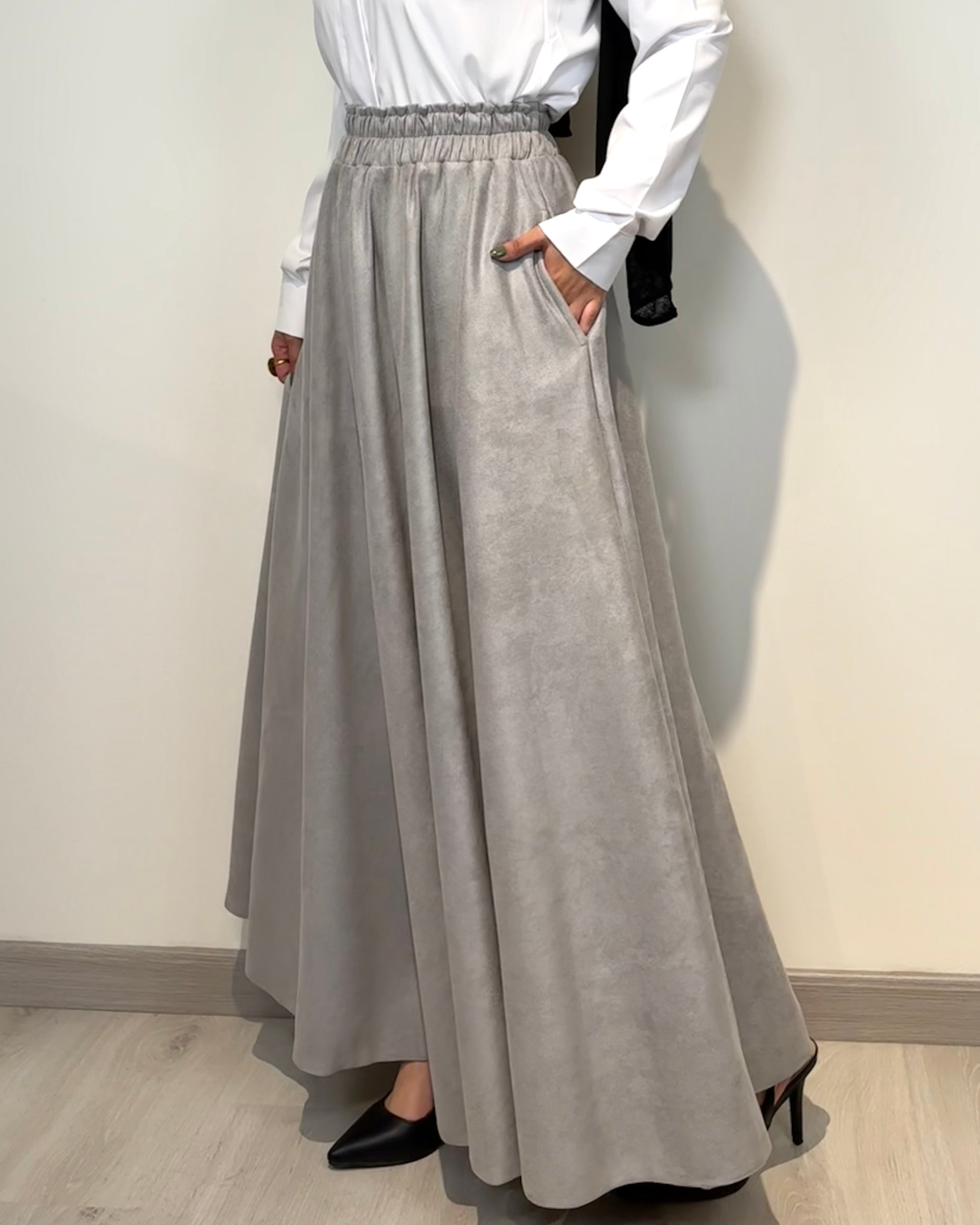 Light grey full cloche suede skirt with soft texture and elegant modest style