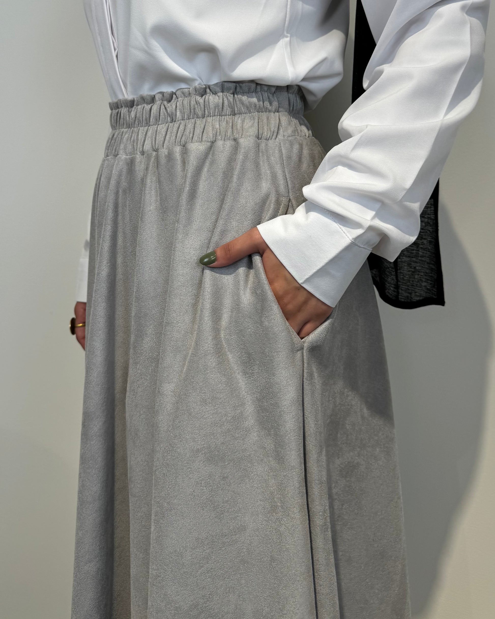 Light grey full cloche suede skirt with soft texture and elegant modest style