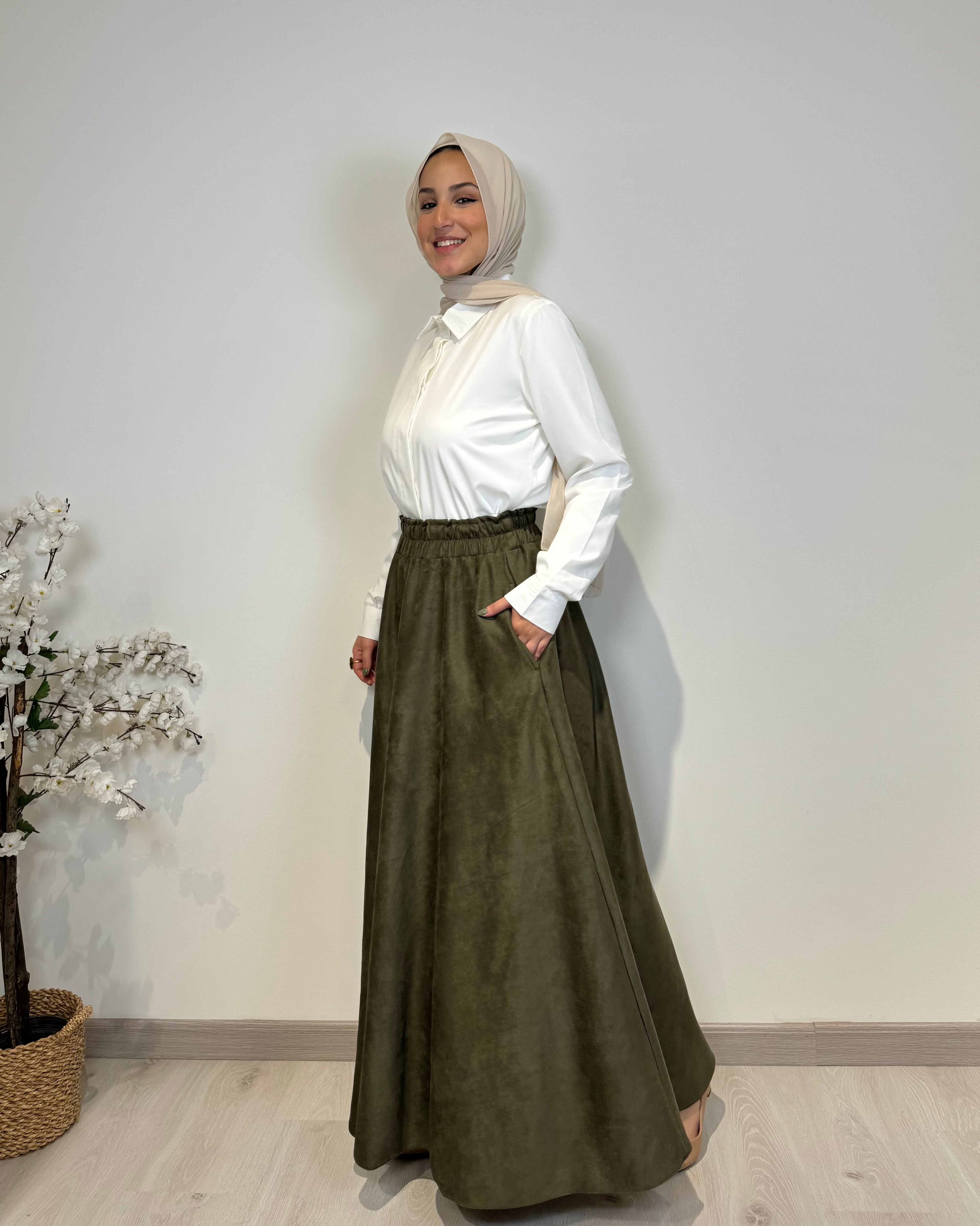 Olive full cloche suede skirt with soft texture and elegant modest style